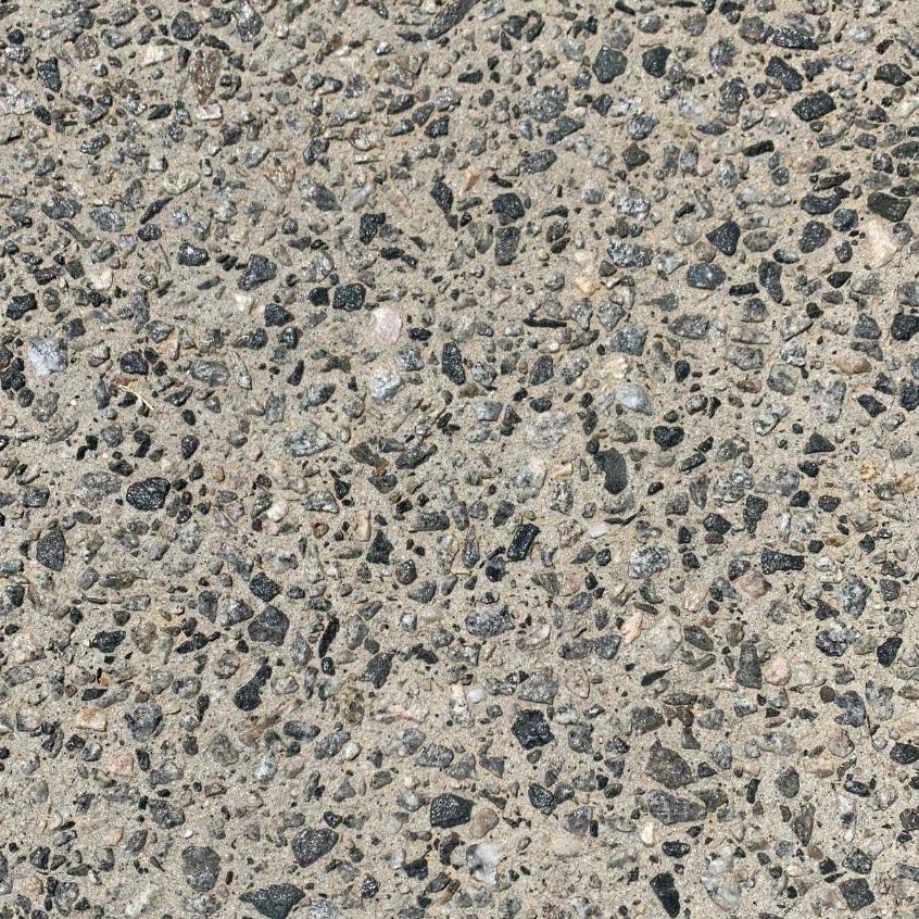 Close view of charcoal and buff exposed aggregate blend at full exposure