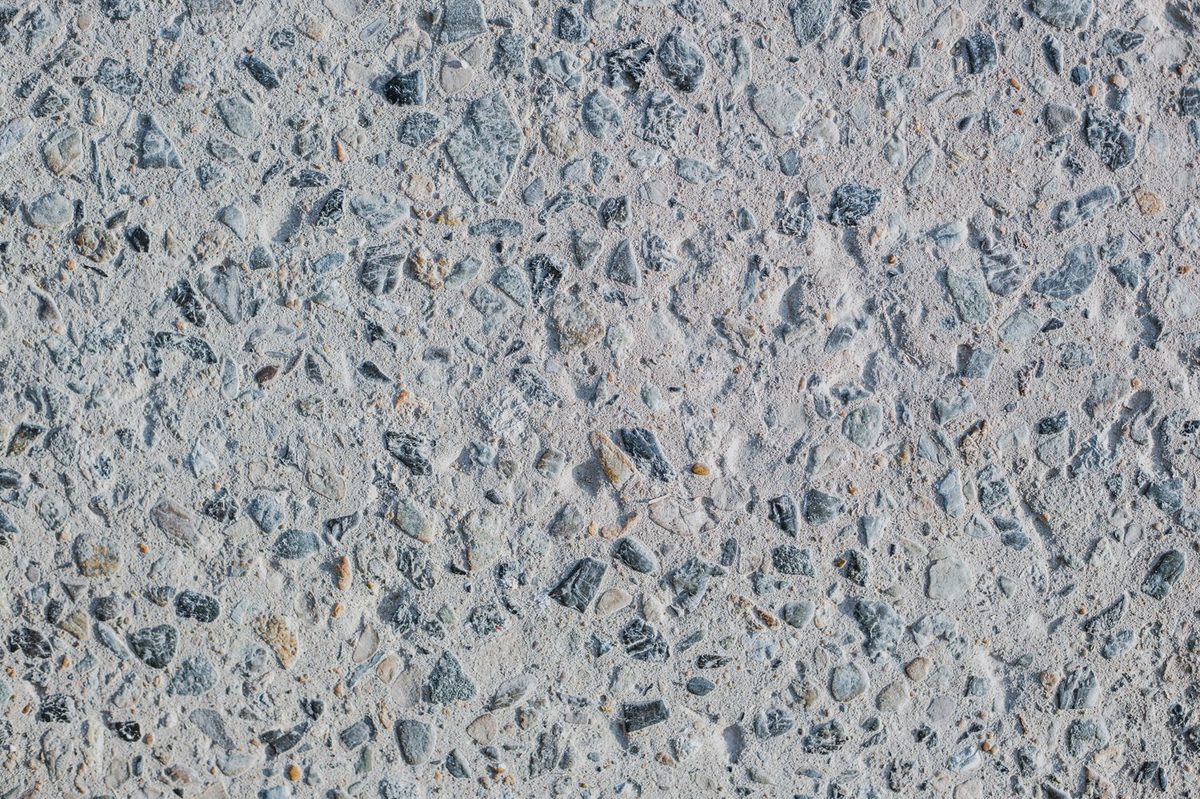 Charcoal fleck exposed aggregate over an off white paste